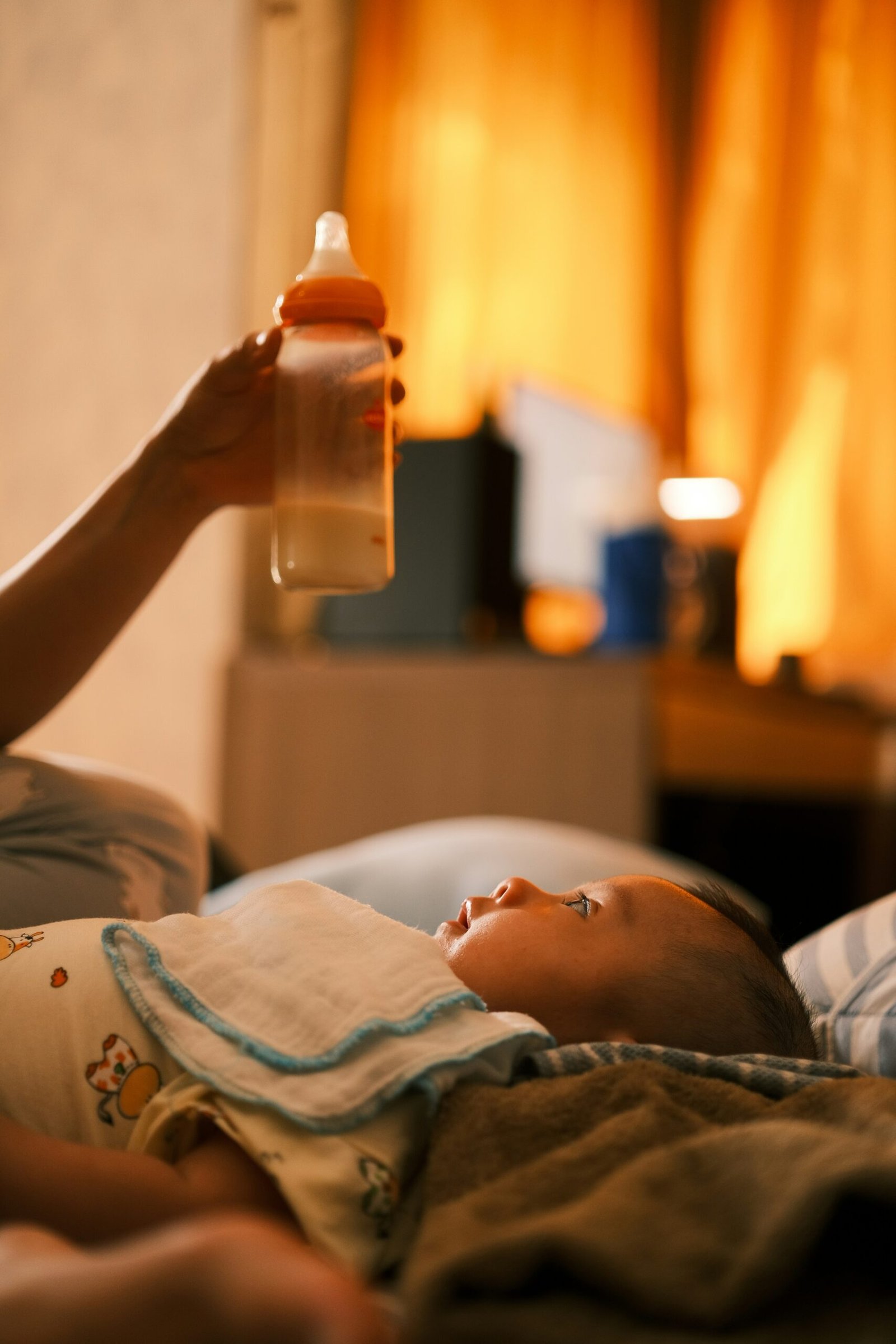 A newborn caregiver settling a baby overnight
