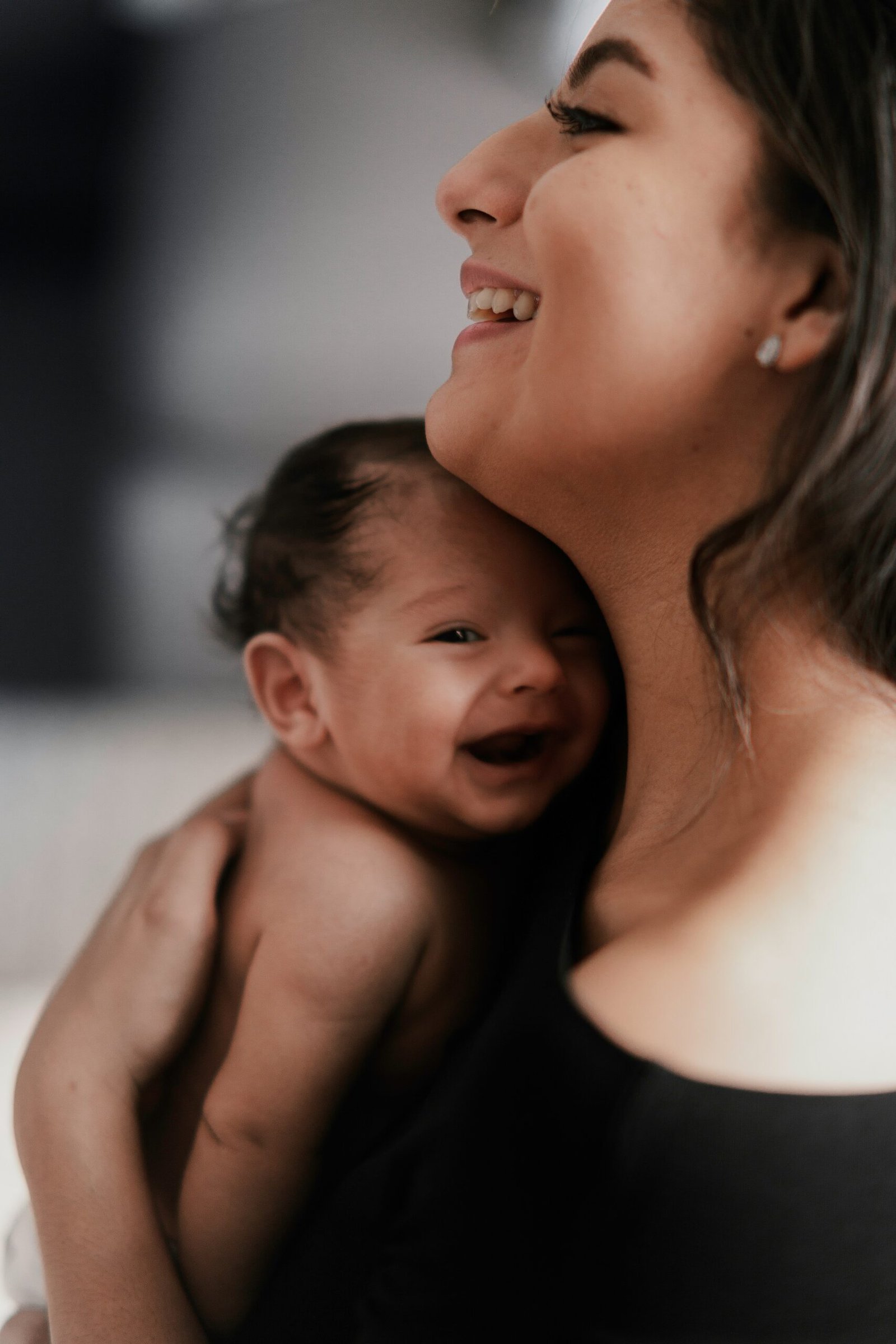 A postpartum doula and parent together