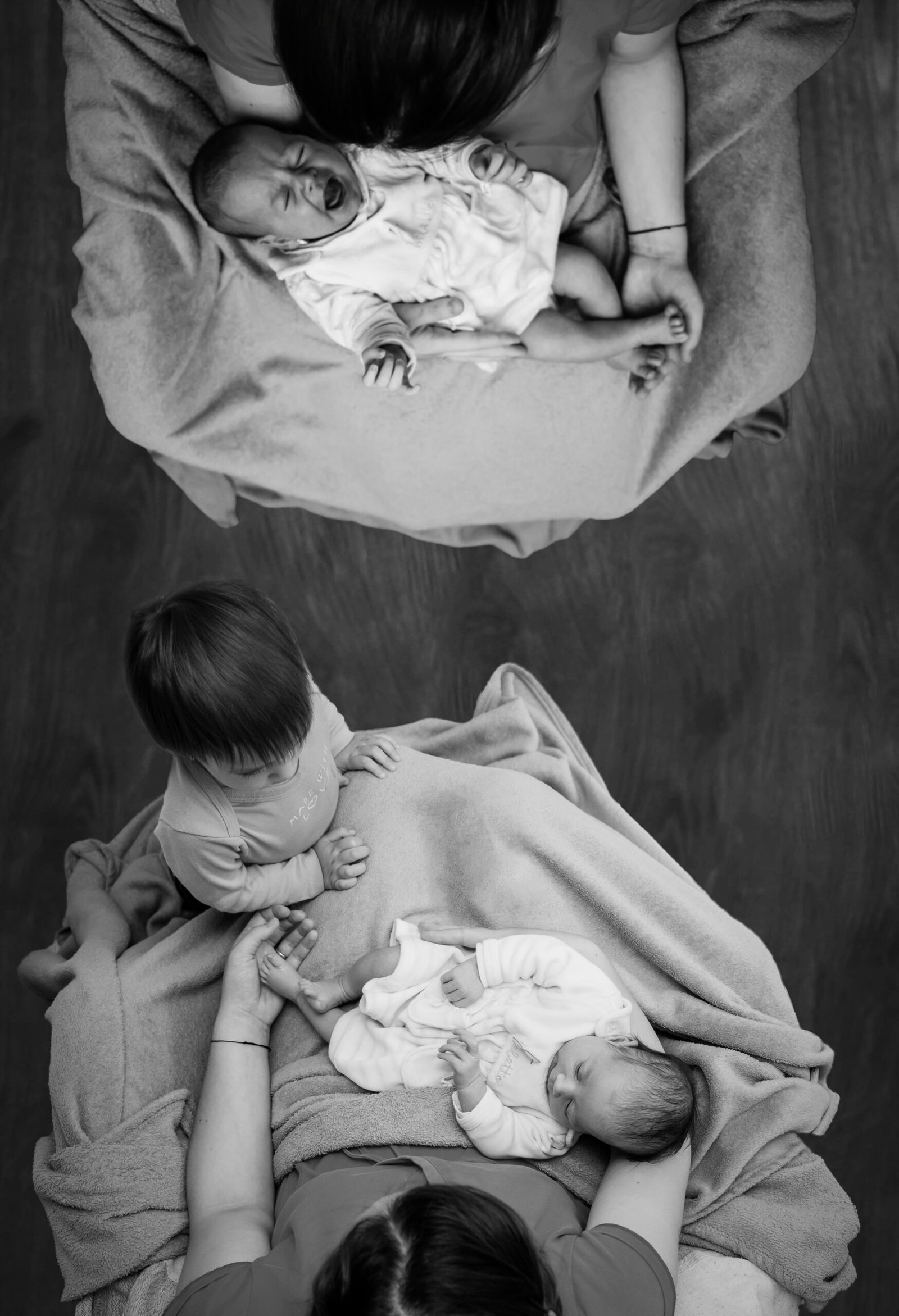 Caregiver holding a newborn in a warm, comfortable home